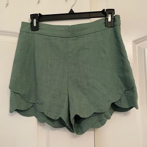 Green scalloped shorts